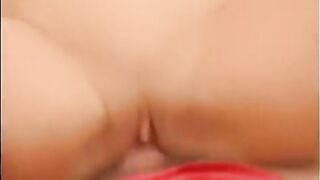 A blonde girl is having a lot of fun and satisfaction