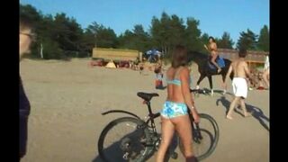 A girl is fucking on the beach without any clothes on