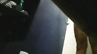 In the shower, there is a hidden camera capturing a girl's intimate moments