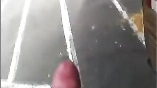 A guy masturbates his dick on the street and shoots cum