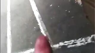 A guy masturbates his dick on the street and shoots cum