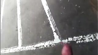 A guy masturbates his dick on the street and shoots cum