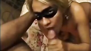 A woman is having fun with another guy in front of her husband
