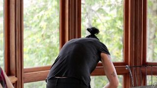 A Vietnamese girl is fucking with a lesbian in the kitchen