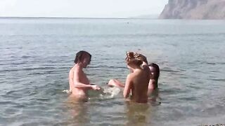 A girl is completely naked on the beach