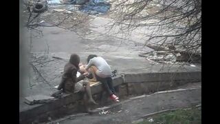 A young couple engaged in public sex on the street, captured in a daring shot