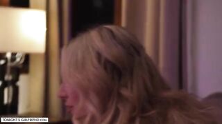 Busty blonde porn star Kayley Gunner gives a foot job in stockings