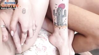 Four college students are having a fun time together in the bedroom