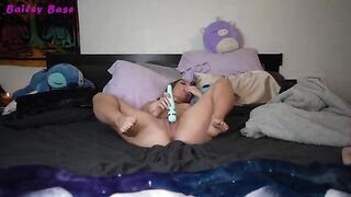 A young woman plays with her feet and reaches a powerful orgasm