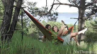 A girl gets a tan in a sensual lesbian encounter outdoors