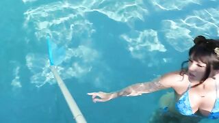 A tattooed French girl is having fun by the pool, showcasing her wild side