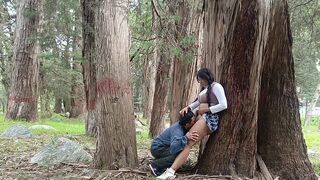 A pretty woman has sex with a man in the jungle