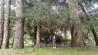 A pretty woman has sex with a man in the jungle