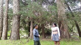 A pretty woman has sex with a man in the jungle
