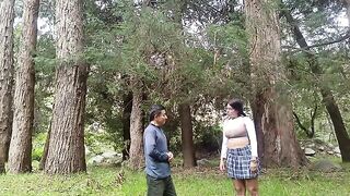 A pretty woman has sex with a man in the jungle