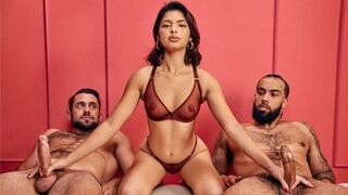 Their hands work in sync, and the guys moan in unison. A hot brunette threesome scene