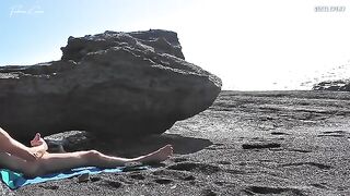A girl undresses on the beach and rubs herself, while a guy masturbates