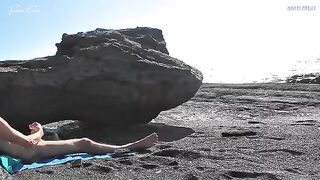 A girl undresses on the beach and rubs herself, while a guy masturbates