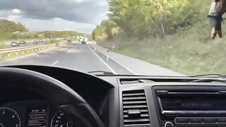 A girl is having fun with her Uber driver in the car