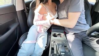 The girl has sex in the car with her head on his dick