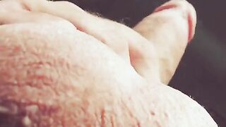 The hand slides along the barrel, up and down, with intense pleasure