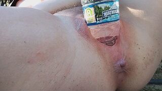 A busty milf reached the peak of pleasure while masturbating outdoors