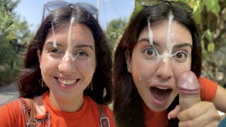 A girl gets her fingers in a stranger's hair and performs oral on him outdoors