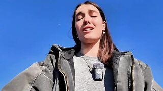 A hot brunette gets naughty on the beach in a daring vlog