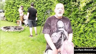 A girl is checking out some guy's balls without his knowledge