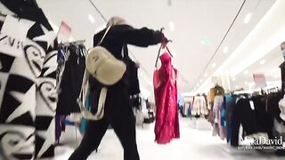 A hot girl was almost caught while giving a blowjob in the fitting room
